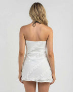 Isla Mini Dress by Lauven, elegant strapless sheath dress with delicate ruffle details, back view.