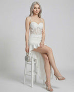 Isolde Maxi Dress by Lauven, featuring an asymmetrical white design with lace corset bodice and high-low hem.