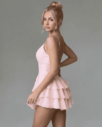 Isolde Mini Dress by Lauven, featuring a V-neckline and layered ruffle skirt in soft pink.