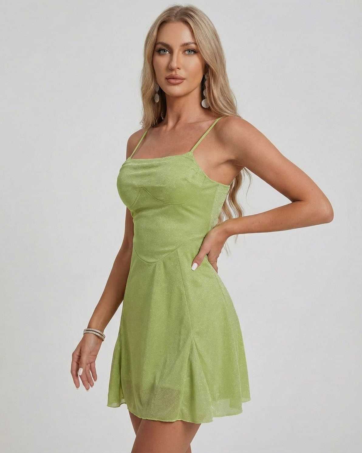 Ivy Mini Dress by Lauven featuring a shimmering A-line silhouette in a vibrant green color.