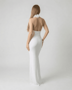 Lumière Maxi Dress by Lauven - Back view of a white deep V neck backless maxi dress with 3D floral detail.
