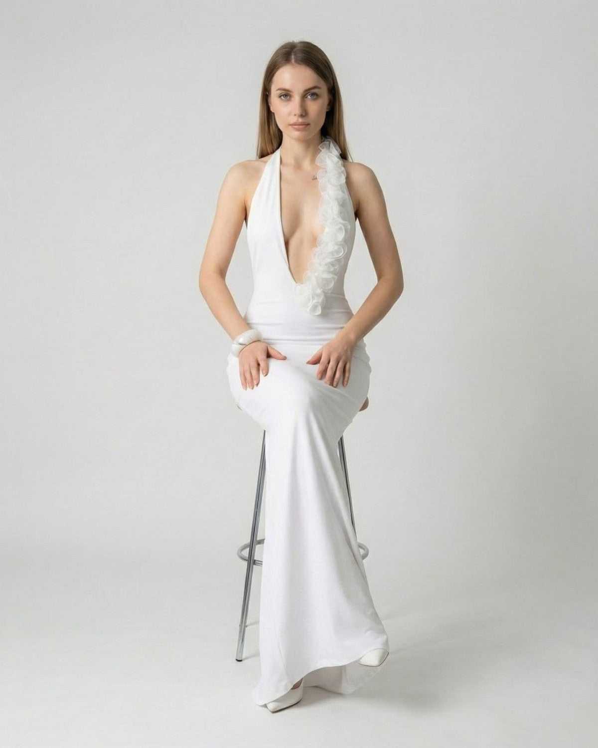 Lumière Maxi Dress by Lauven — White deep V neck backless dress with 3D floral detail, showcasing elegance and style.