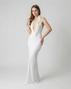 Lumière Maxi Dress by Lauven, elegant white deep V neck backless dress with 3D floral detail.