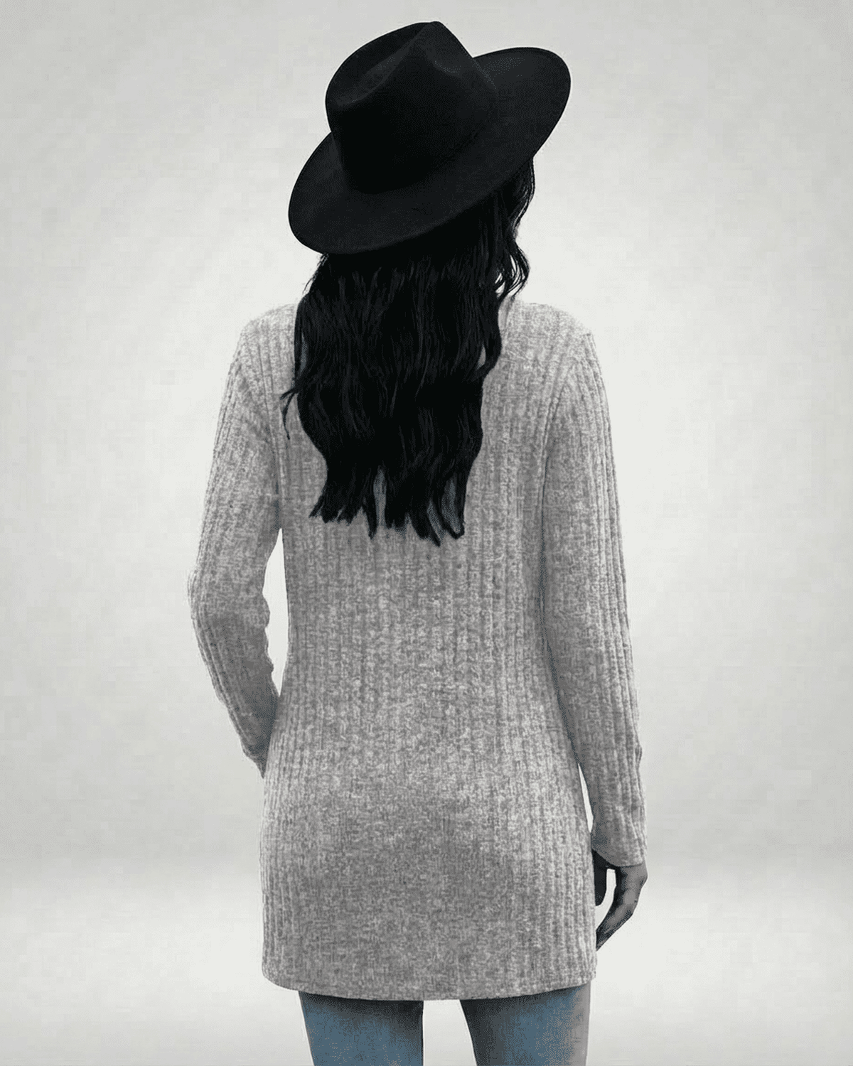 Back view of a model wearing the Luna Cardigan by Lauven, showcasing its longline design and ribbed texture.