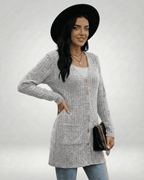 Model showcasing the Luna Cardigan by Lauven, featuring a longline design with button front and ribbed texture.