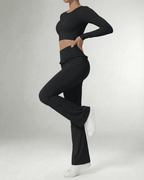 Luna Leggings by Lauven, sleek black flare pants showcasing pockets and a flattering silhouette.
