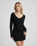 Luna Mini Dress by Lauven, sleek black ribbed knit with long sleeves and a flattering silhouette.