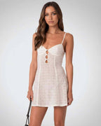 Luna Mini Dress by Lauven, elegant A-line design with spaghetti straps and hollow out detail.