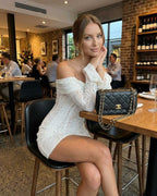 Luna Mini Dress by Lauven - Elegant off-shoulder lace dress in white, perfect for sophisticated dining occasions.