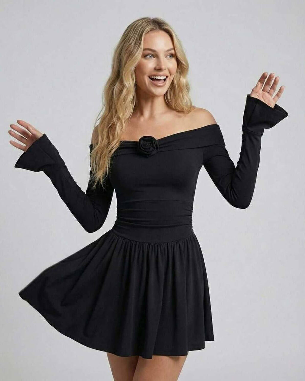 Lauven Luna Mini Dress showcasing off-shoulder floral detail, elegant black fabric, and playful silhouette.