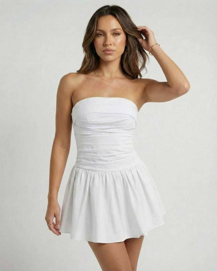 Lauven Luna Mini Dress featuring a classic white strapless A-line silhouette and a flared skirt, perfect for summer.