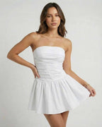 Lauven Luna Mini Dress - Classic white strapless A-line silhouette with empire waist and flared skirt.