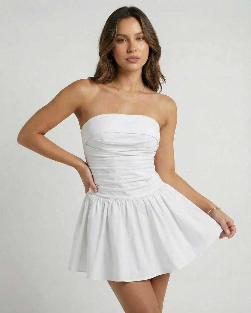 Lauven Luna Mini Dress - Classic white strapless A-line silhouette with empire waist and flared skirt.