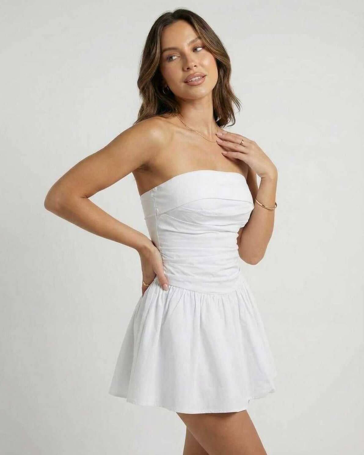 Lauven Luna Mini Dress in classic white strapless A-line silhouette, showcasing a flared skirt and elegant style.
