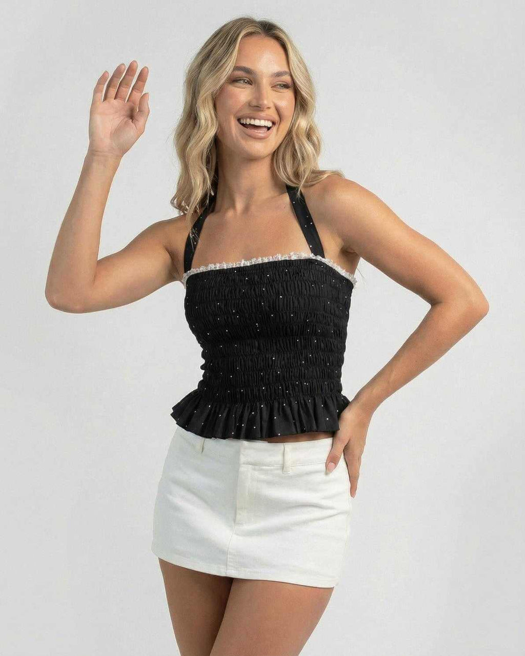 Luna Top by Lauven - Women's halter polka dot slim fit ruffle top in black with playful styling.