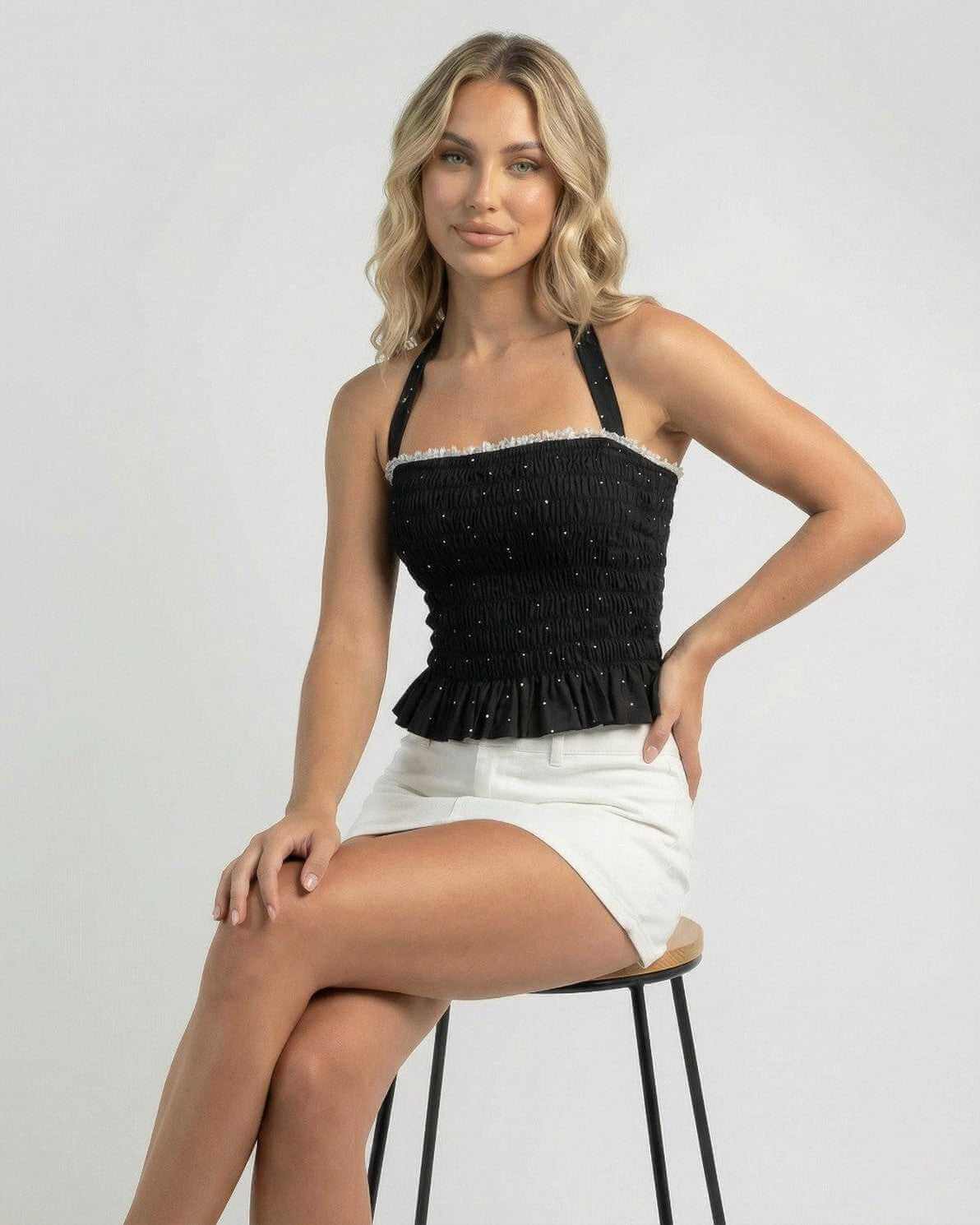 Luna Top by Lauven – Women’s halter polka dot slim fit ruffle top in black, perfect for day-to-night styling.