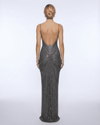 Back view of a woman wearing the Lyra Maxi Dress from Lauven, showcasing its metallic crystal embellishments and elegant silhouette.