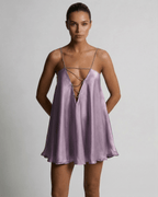 Lyra Mini Dress by Lauven in lilac satin with rhinestone detail, showcasing modern luxury and elegance.