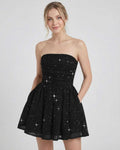 Lyra Mini Dress by Lauven featuring a strapless A-line silhouette with bow detail and a subtle shimmer finish.