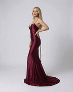 Marcelline Maxi Dress by Lauven in luxurious burgundy satin with slim fit silhouette and spaghetti straps.