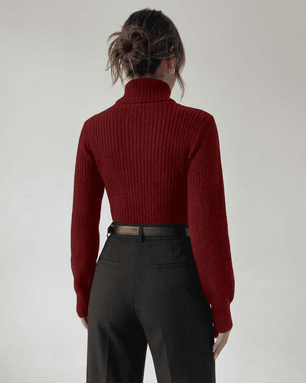 Back view of a woman wearing a Merlot Sweater by Lauven, featuring a mock neck and ribbed knit design.