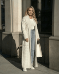 Milano Cardigan styled with denim and a white top, showcasing Lauven's elegant long cable-knit design.