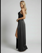 Monaco Maxi Dress by Lauven featuring a sleek black satin design with high slit and elegant evening silhouette.
