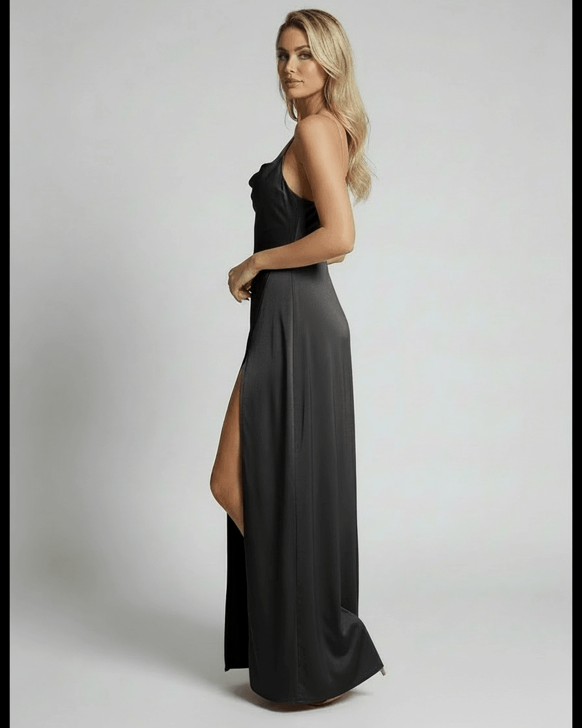 Monaco Maxi Dress by Lauven featuring a sleek black satin design with high slit and elegant evening silhouette.