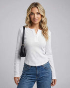 Nara Long Sleeve by Lauven, featuring a women's white long sleeve round neck top with a sleek slim fit.