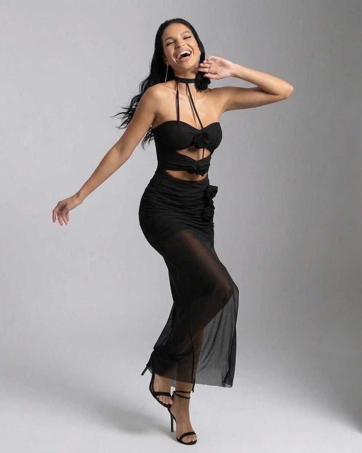 Nerina Maxi Dress by Lauven, elegant black halter neck knitted dress with chic cutout design.