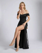Model wearing the Nocturne Maxi Dress by Lauven, showcasing its off-shoulder corset silhouette and elegant design.
