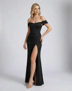 Nocturne Maxi Dress by Lauven, elegant off-shoulder corset evening dress with slit and pleated wrap effect.