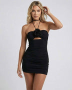 Noir Mini Dress by Lauven featuring a halter neck and cut-out detail in sleek black fabric.