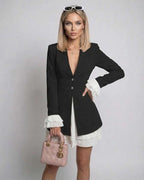Noir Mini Dress with Ruffle Contrast and Deep V-Neck, created by Lauven, showcasing a sleek and elegant style.
