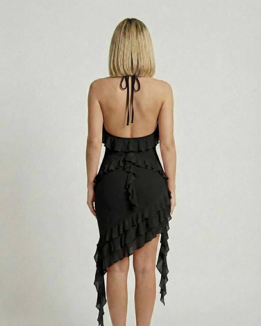 Back view of Lauven Noir Mini Dress featuring ruffle detail and asymmetrical hemline in classic black.