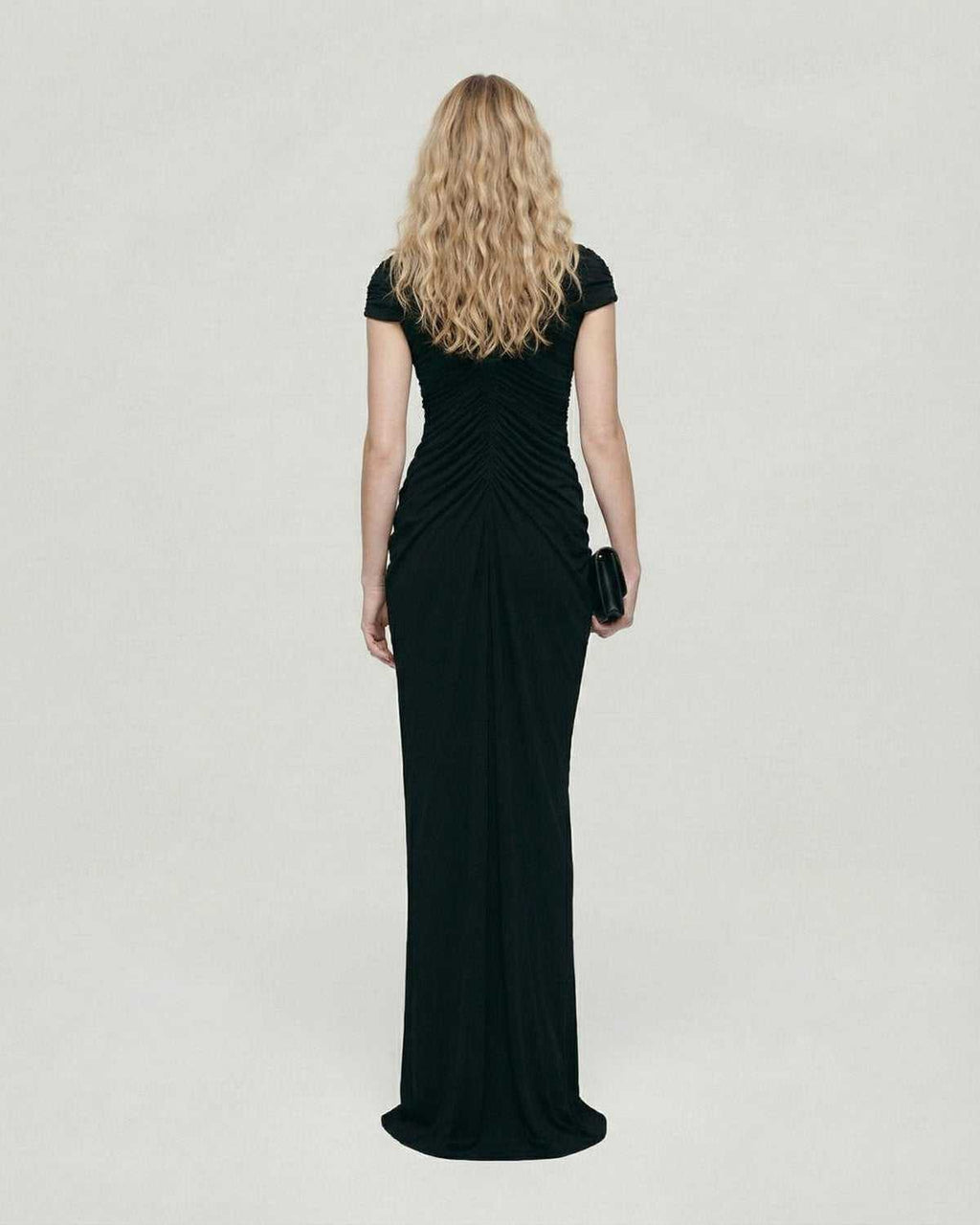 Noiré Maxi Dress by Lauven, showcasing the back view of a black evening maxi dress with ruched detail.