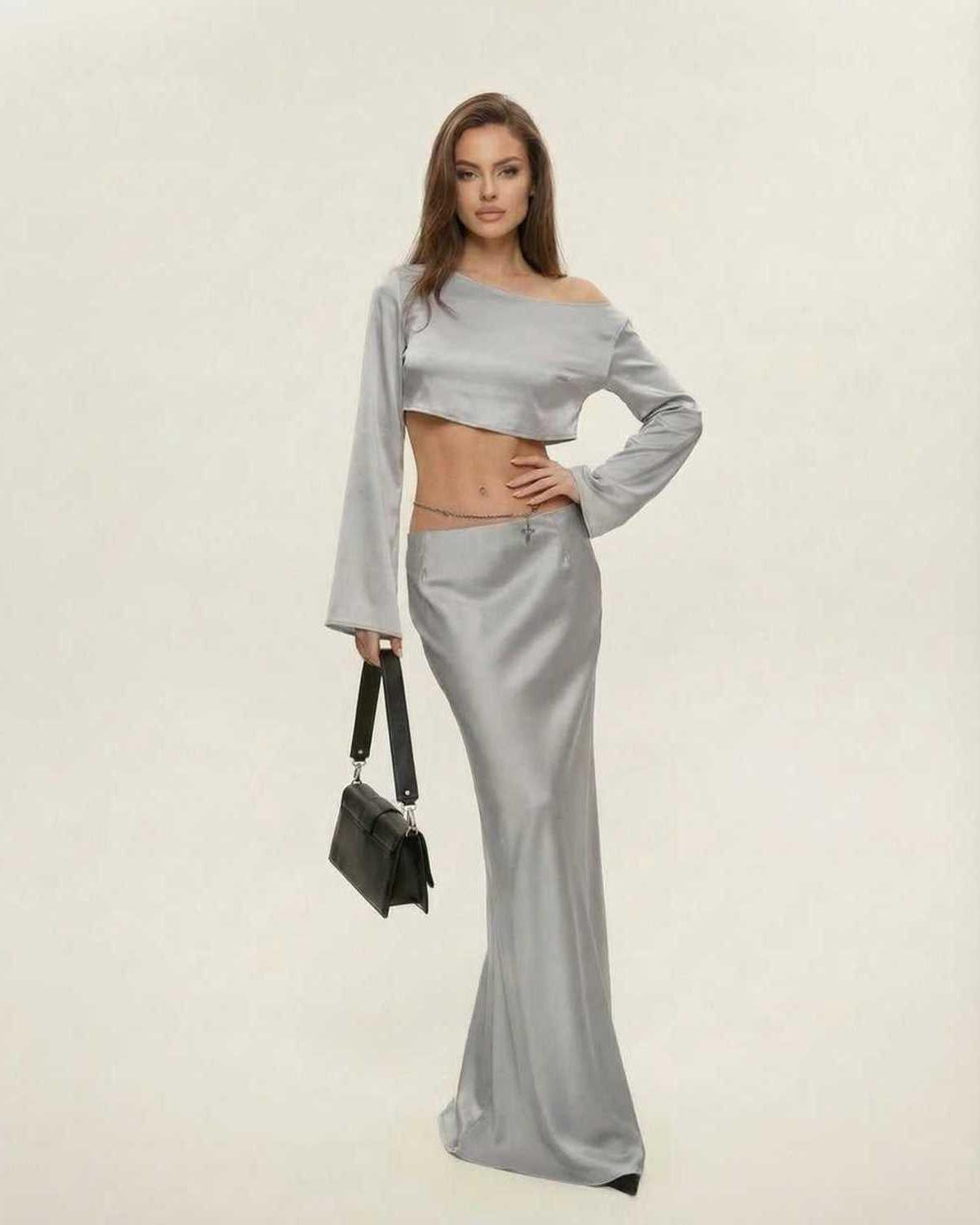 Lauven Nova Midi Dress with asymmetrical design, sleek silver fabric, and chic slash neckline, perfect for modern elegance.