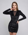 Model wearing Lauven's Nova Mini Dress featuring sparkling velvet and sheer mesh panel detail.