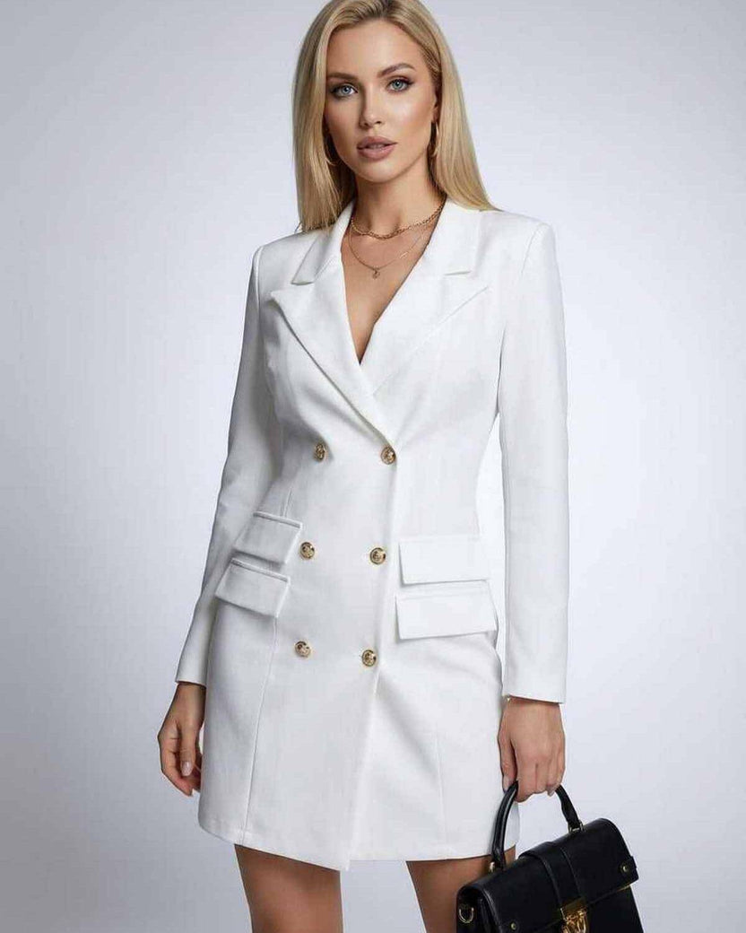Model wearing the Nova Mini Dress by Lauven, a white double-breasted blazer dress with V-neck and long sleeves.