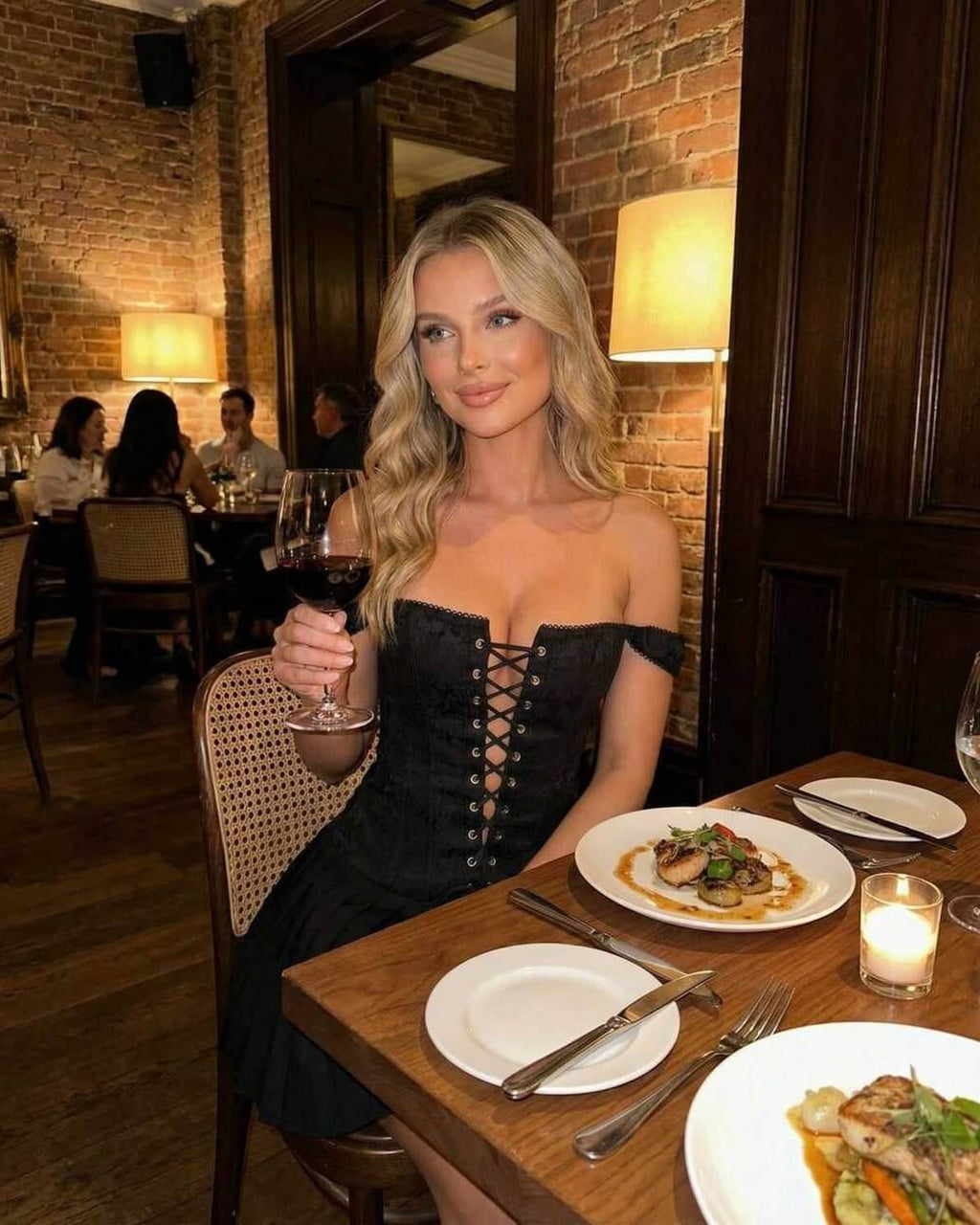 Nova Mini Dress by Lauven worn at a restaurant, showcasing an off-shoulder style and sleek design.