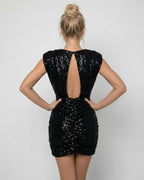 Onyx Mini Dress by Lauven showcasing a black sequin bodycon style with a sleek back design.
