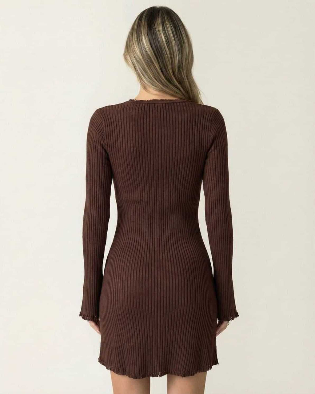 Back view of the Orion Mini Dress by Lauven, showcasing its ribbed fabric and flare sleeves in deep chocolate brown.