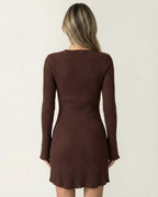 Back view of the Orion Mini Dress by Lauven, showcasing its ribbed fabric and flare sleeves in deep chocolate brown.