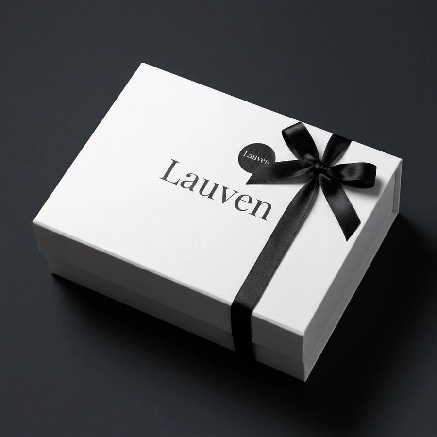 The Lauven gift box, closed and tied with the black ribbon