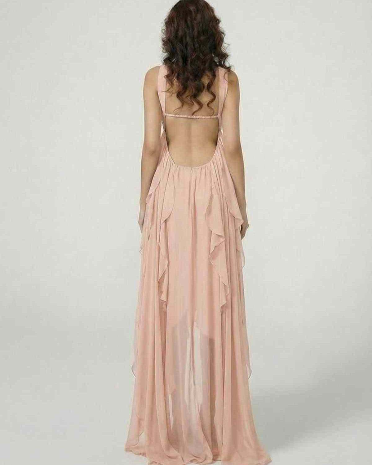 Back view of a model wearing the Peachira Maxi Dress by Lauven, featuring cascading ruffles and a flowing silhouette.