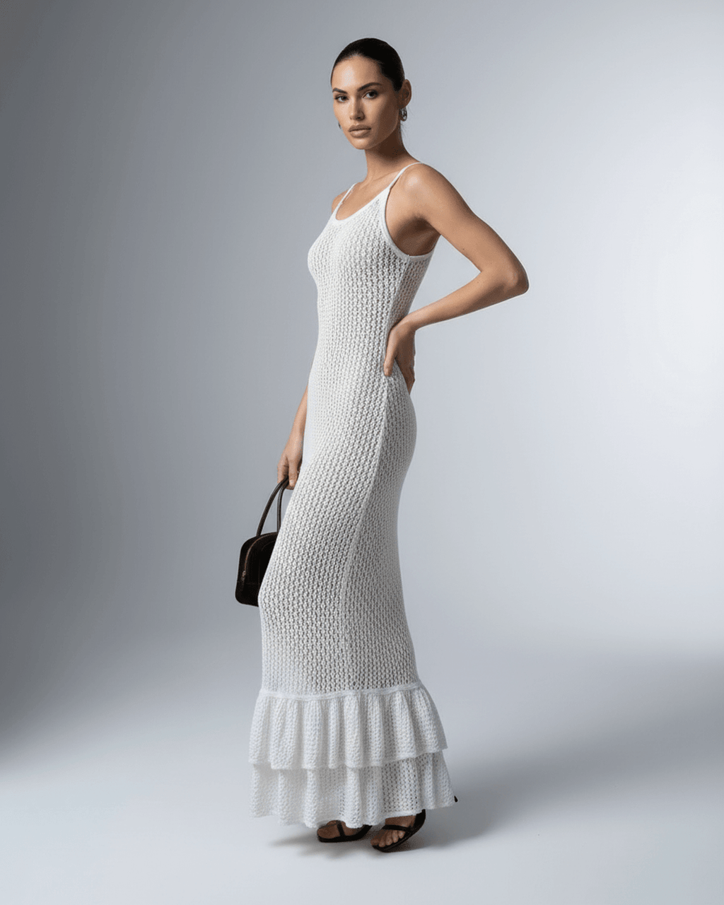 Pearl Maxi Dress by Lauven, elegant white hollow out bodycon maxi dress with ruffled hem and delicate shoulder straps.