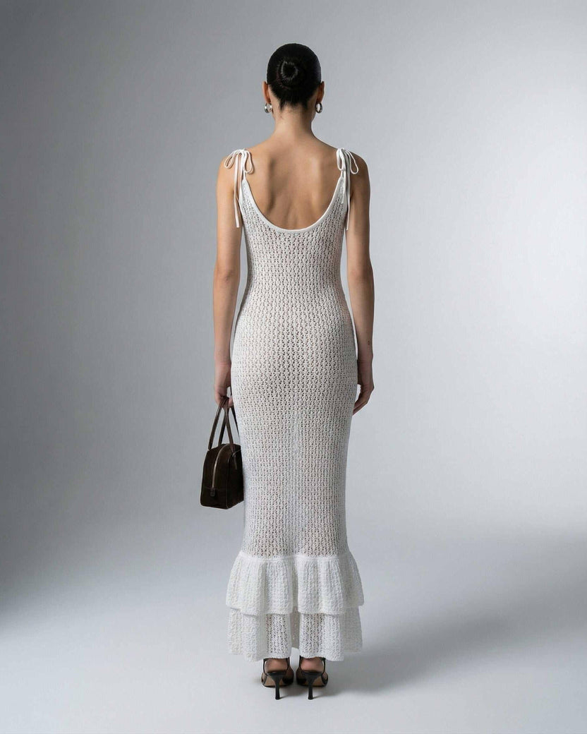 Pearl Maxi Dress by Lauven showcasing a hollow-out knit texture in an elegant white design.