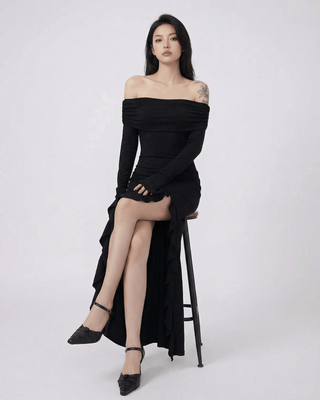 Raven Maxi Dress by Lauven — Black off-shoulder dress with asymmetrical ruffles and flare sleeves.