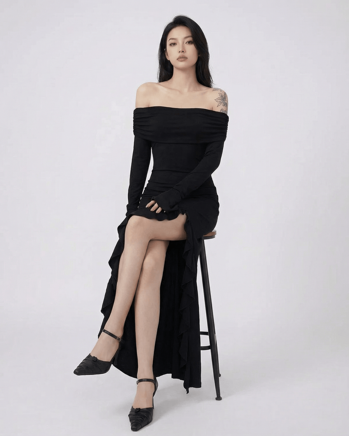 Raven Maxi Dress by Lauven — Black off-shoulder dress with asymmetrical ruffles and flare sleeves.