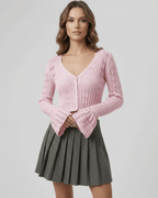 Roselle Cardigan: Soft pink cropped sweater with refined openwork detailing, by Lauven, perfect for a feminine everyday look.